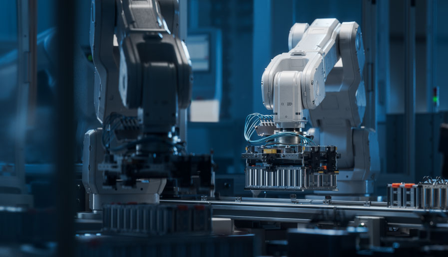 robotic arms working in a clean high tech manufacturing environment